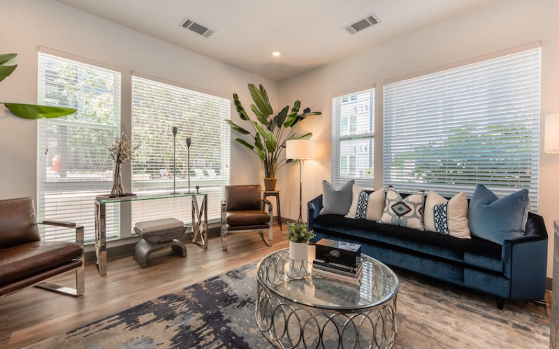 Living area with large windows at Uptown 550