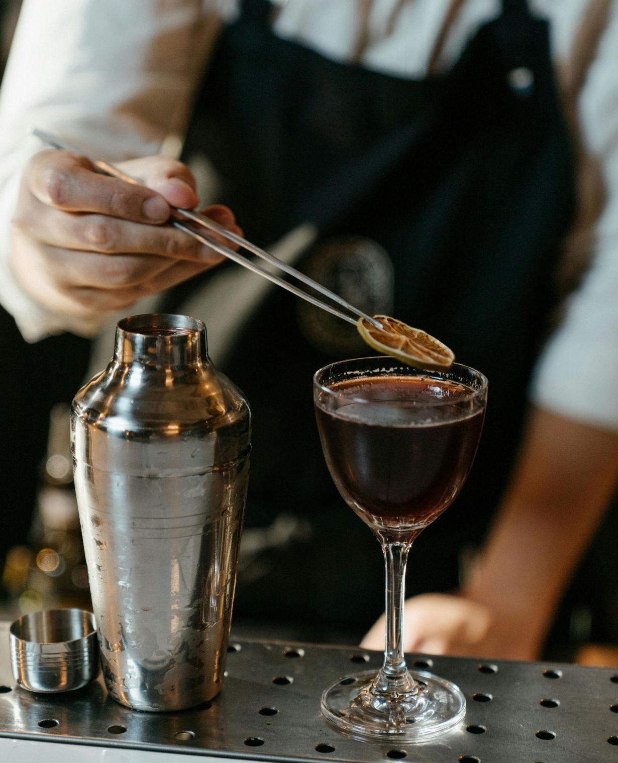 Bartender crafting a fancy cocktail