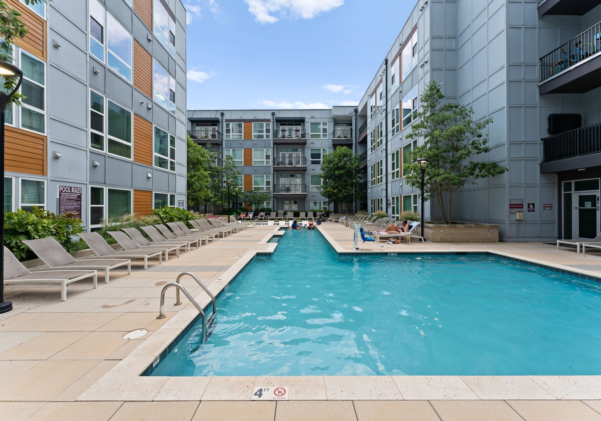 Uptown 550 luxury bathroom with floor to ceiling windows, soaking tub, and modern rain shower
