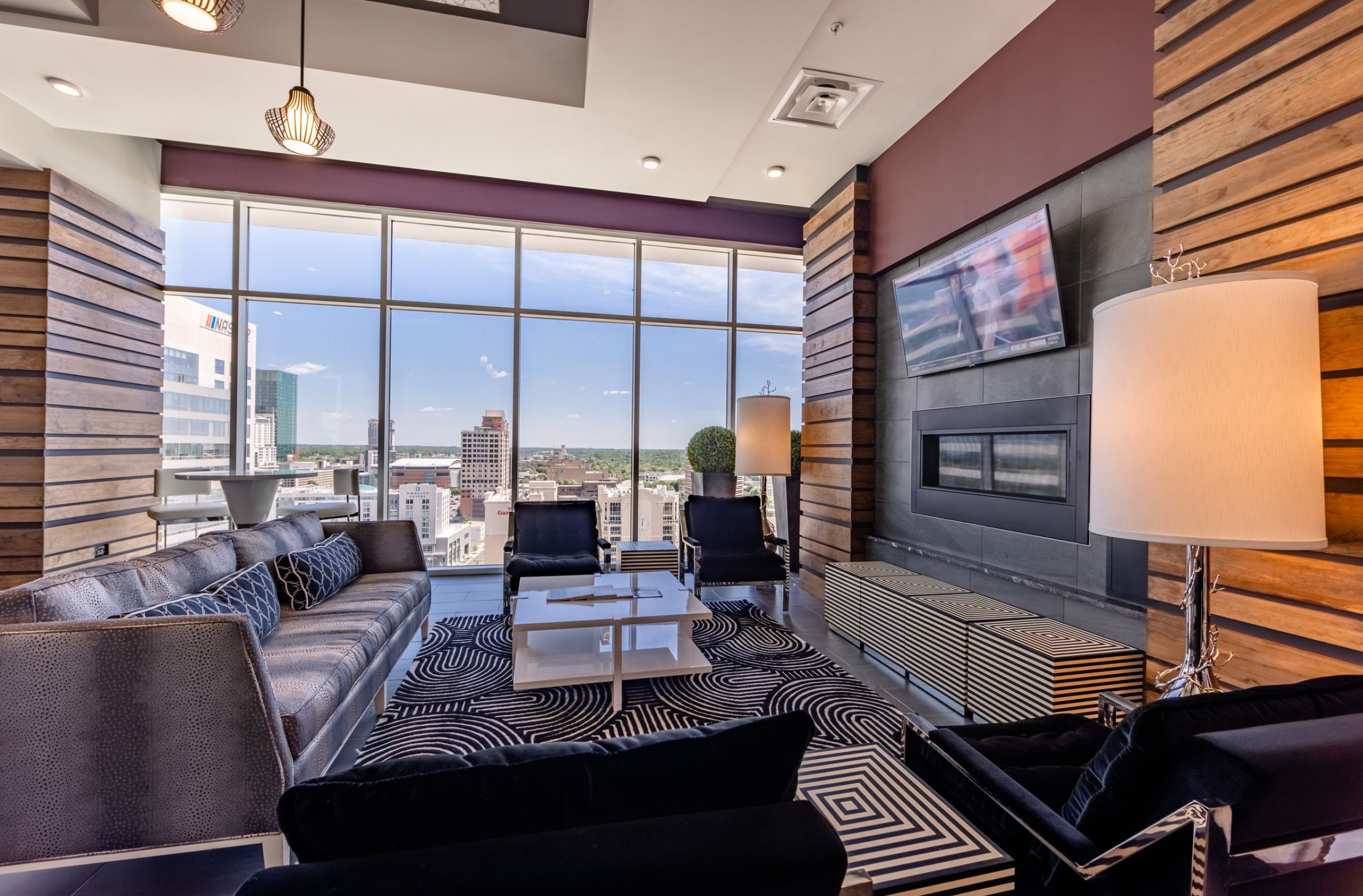 Uptown 550 on Brooklyn rooftop lounge with city views, tv, fireplace, and comfy seating