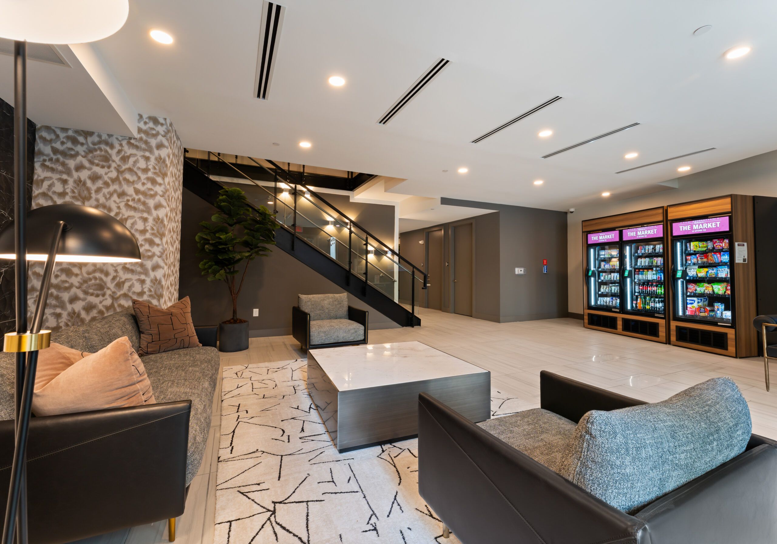 Uptown 550 luxury bathroom with floor to ceiling windows, soaking tub, and modern rain shower