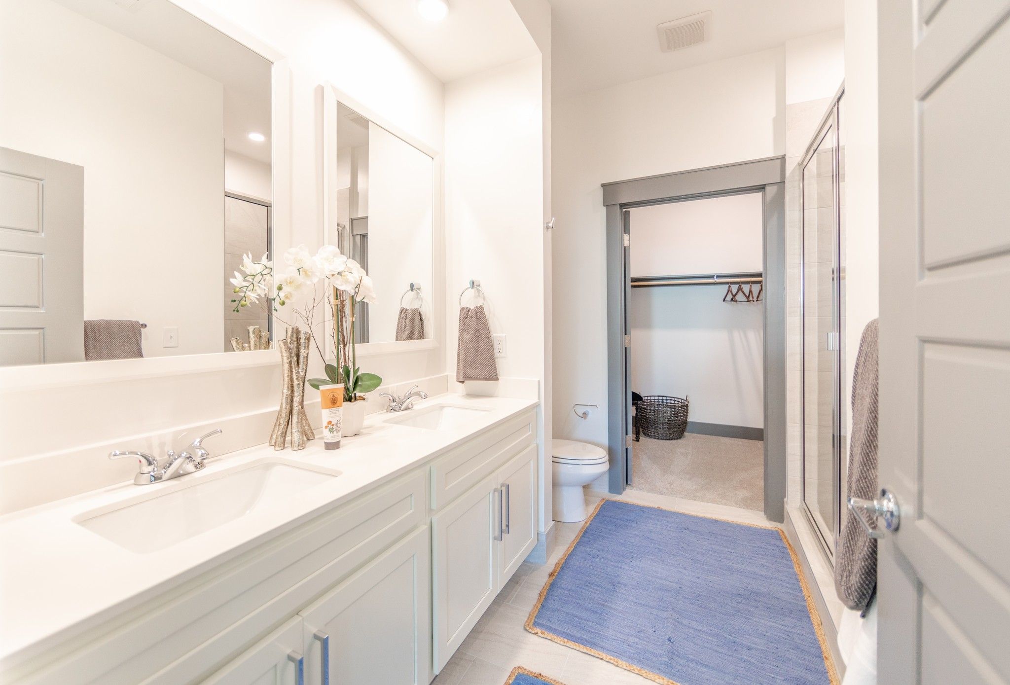 Uptown 550 the Midrise modern apartment building bathroom with white countertops