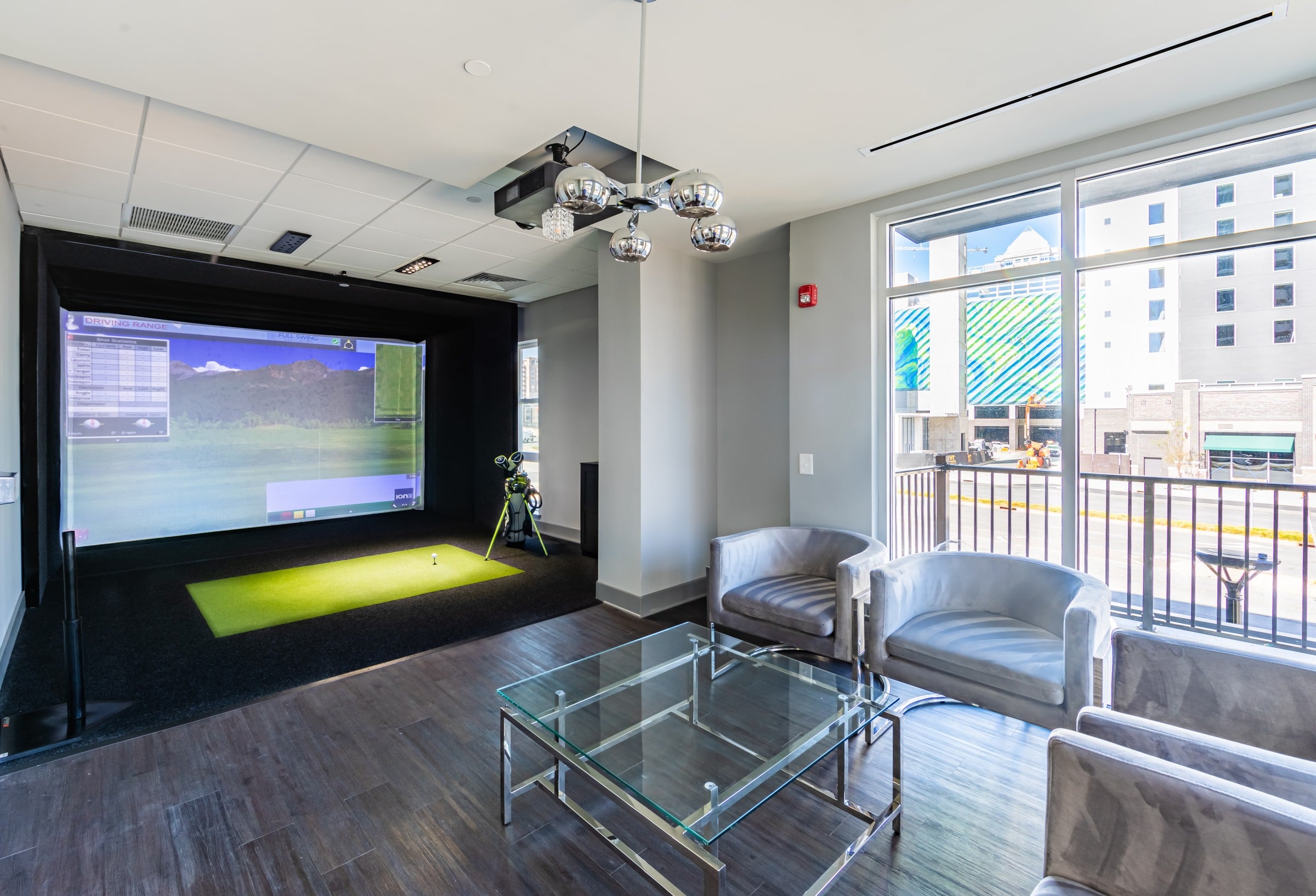 Uptown 550 indoor golf simulator with seating area